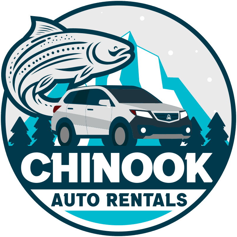 curving fish with mountain and evergreens in background, silver suv in foreground Chinook Auto Rentals