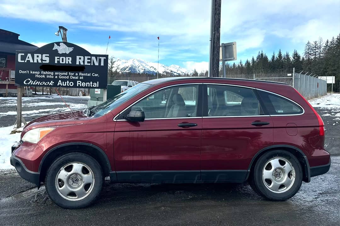 Cars for Rent = Don't keep fishing around for a rental car - hook into a good deal at Chinook Auto Rental - sign behind red mini suv